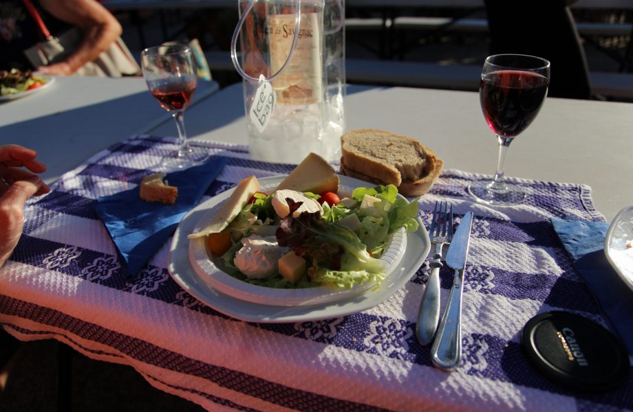 A communal feast featuring the popular red wine of Perigord Noir region A communal feast featuring the popular red wine of Perigord Noir regionregion