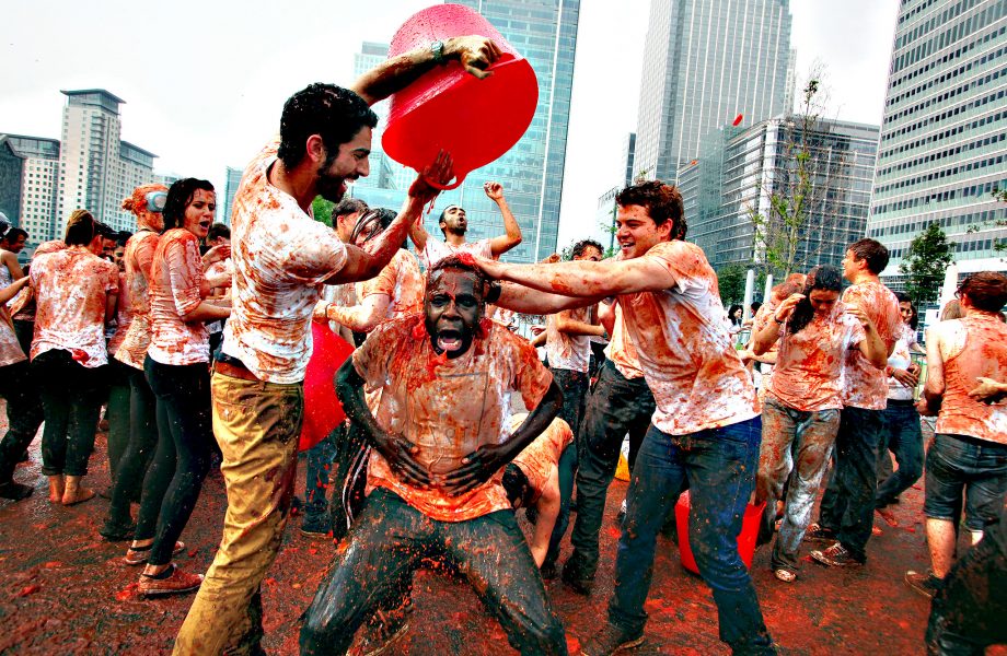 Recreating La Tomatina at Canary Wharf in London Recreating La Tomatina at Canary Wharf in London