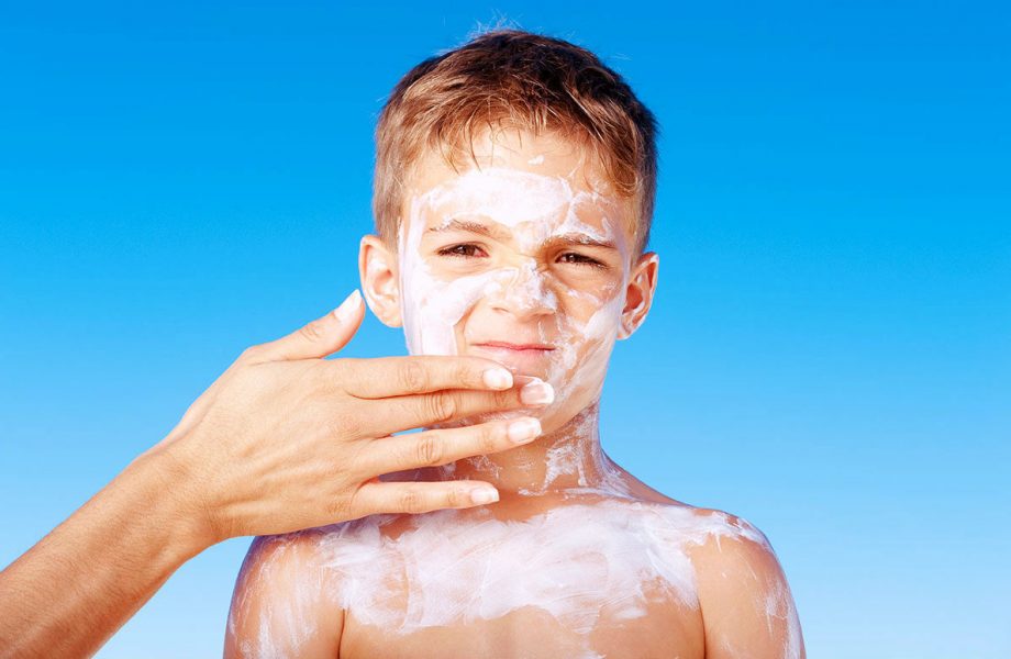 Lathering on sunscreen Lathering on sunscreen