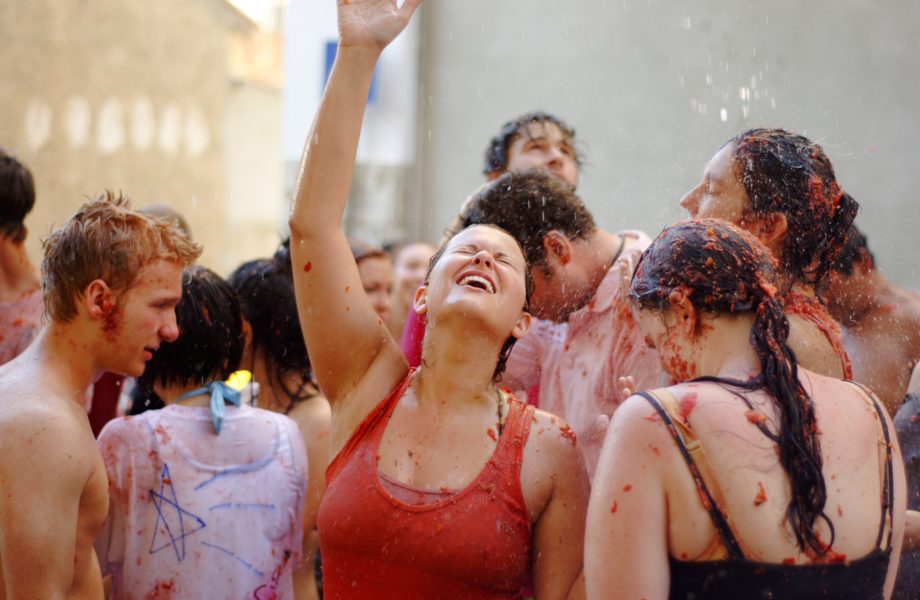 Washing off after La Tomatina festival Washing off after La Tomatina festival