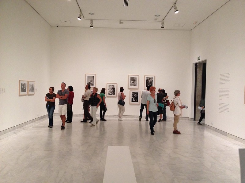 People looking at paintings