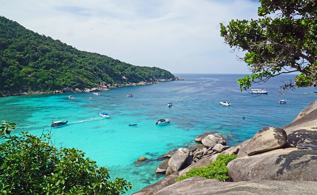 Blue sea water with boats