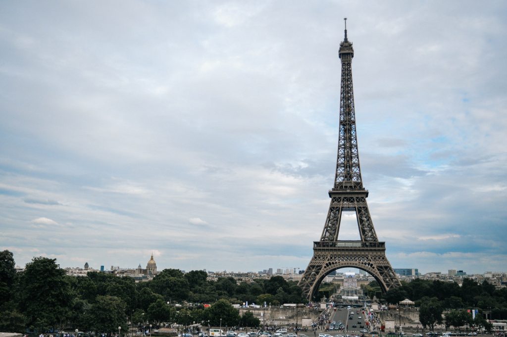A long shot photograph of Eiffel Tower amid the busy city of Paris