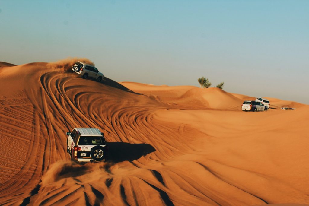 Cars bashing into the sand dunes