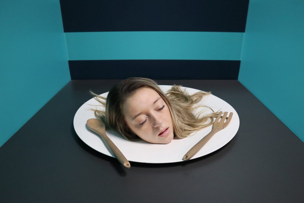 Illusionary room where head of a human is seen served on a plate