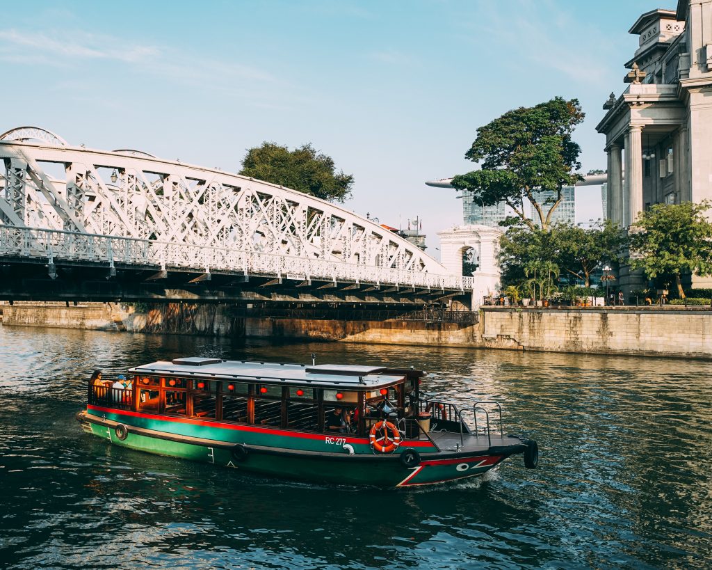 A bumboat carrying tourists around the anderson bridge