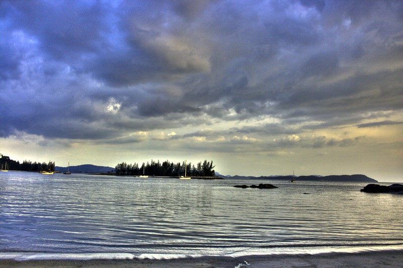 a walk on the white sand along the sunset with a loved one.