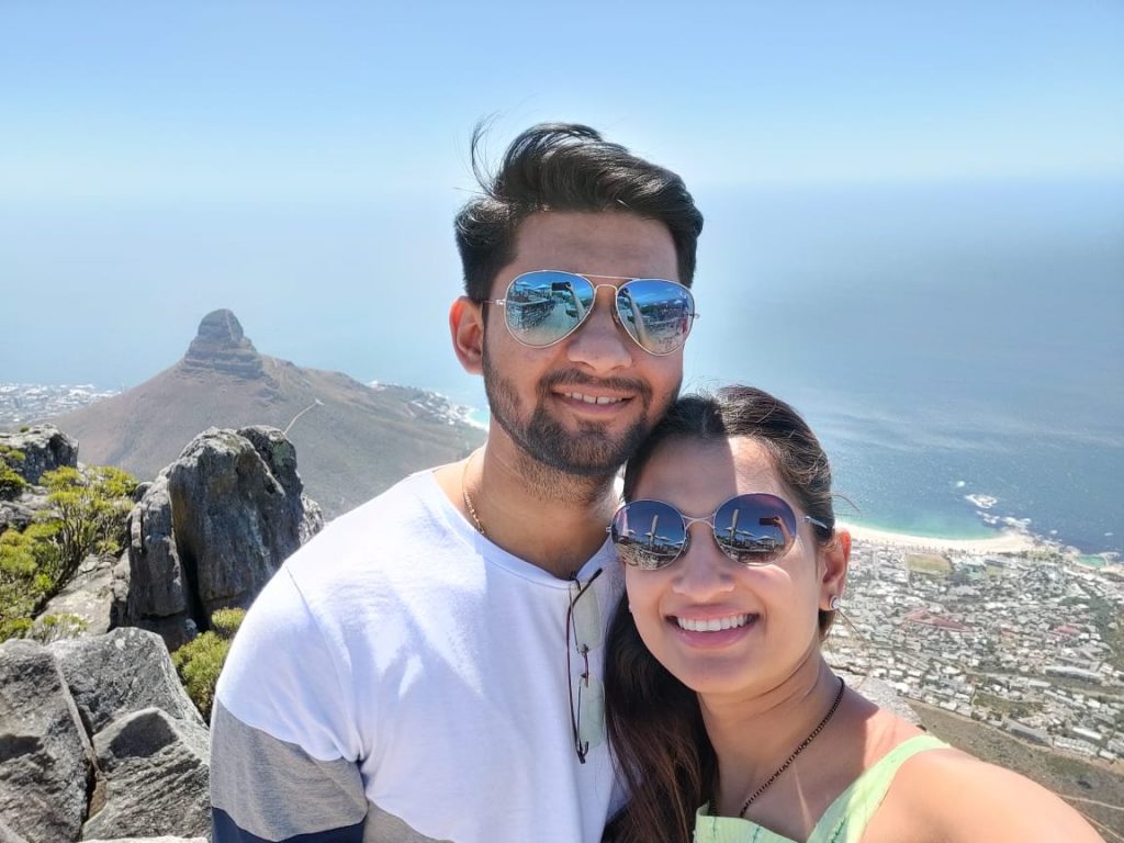 A couple clicking a selfie at a beach in South Africa