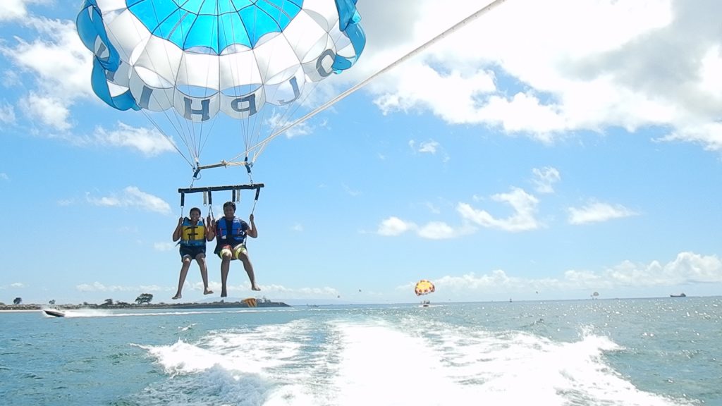 sons enjoying water sports