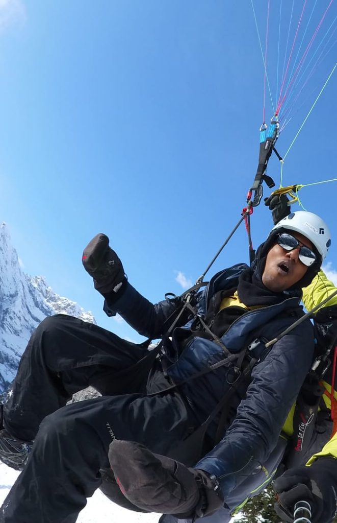 A picture of a guy flying high on their honeymoon trip to Europe
