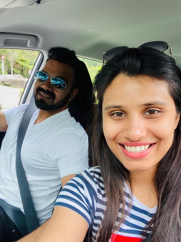 A couple driving in the roads of New Zealand