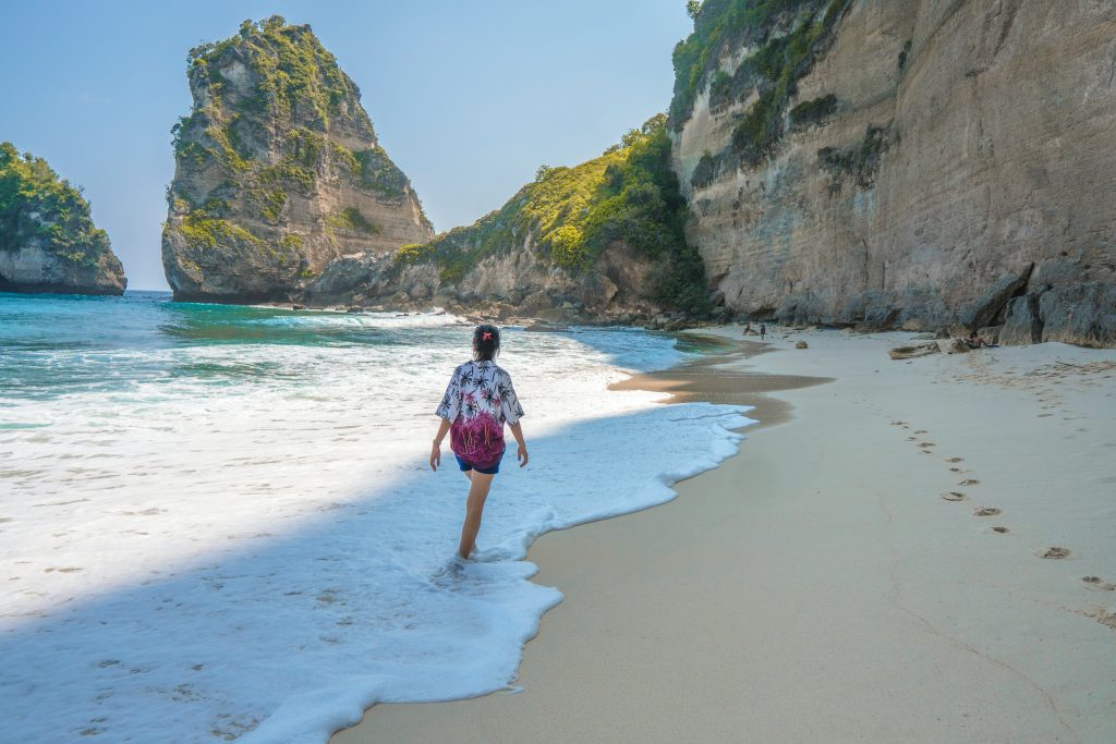 Woman walking in a beach in Nusa Penida
