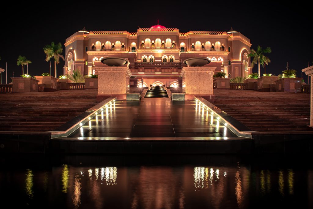 A night view of the Emirates Palace lit up with lights