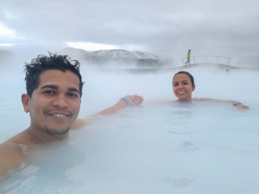 A couple taking a bath in the cold water in Iceland
