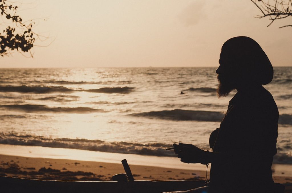 man at beau vallon beach in mahe