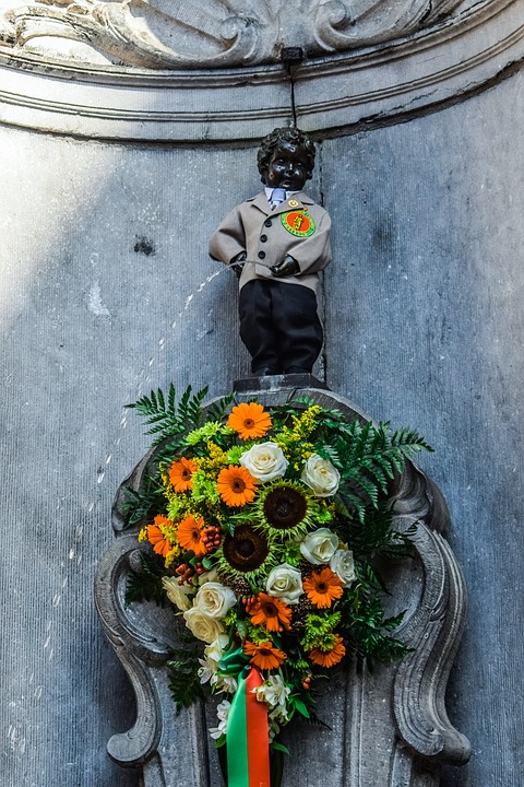 Dressing Manneken Pis in Belgium wearing a suit