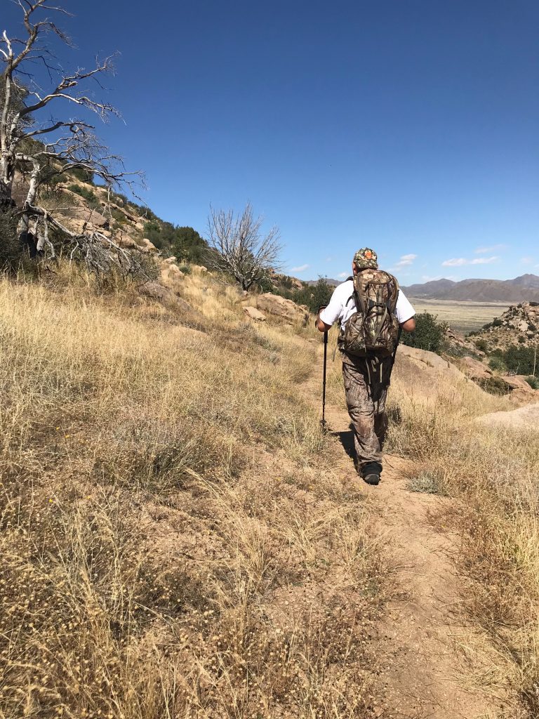 A man hiking in the slopes of mountain