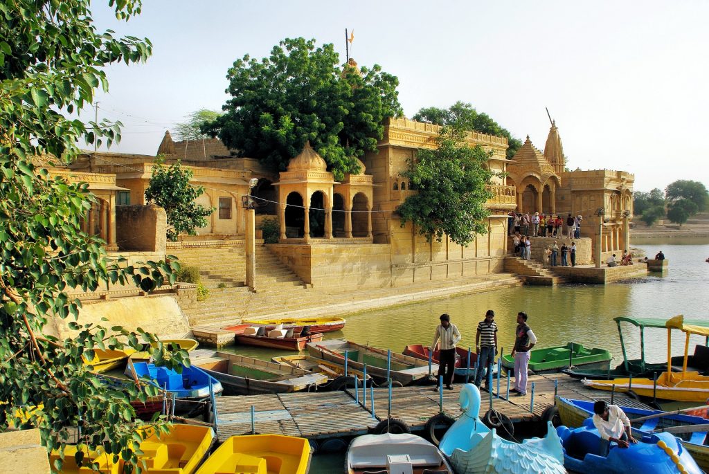 People and boats at Gadsisar Lake in rajasthan