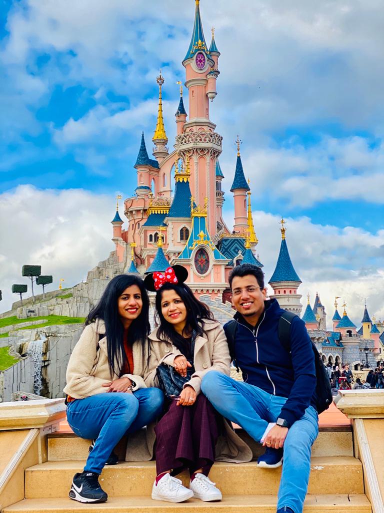 with my family in front of disney land