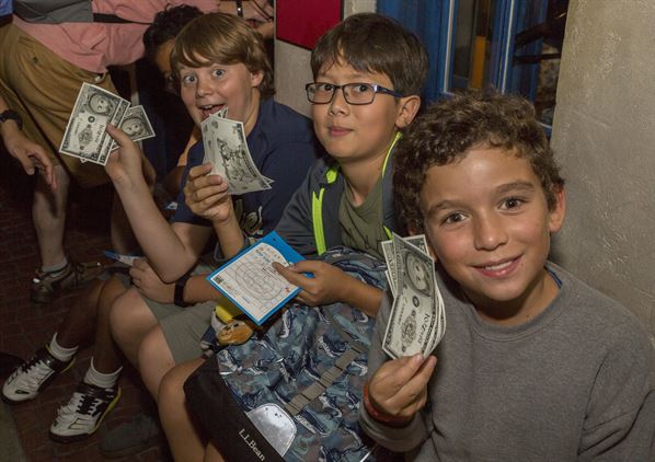 Kids with KidZos, the official currency of Kidzania in Kuala Lumpur