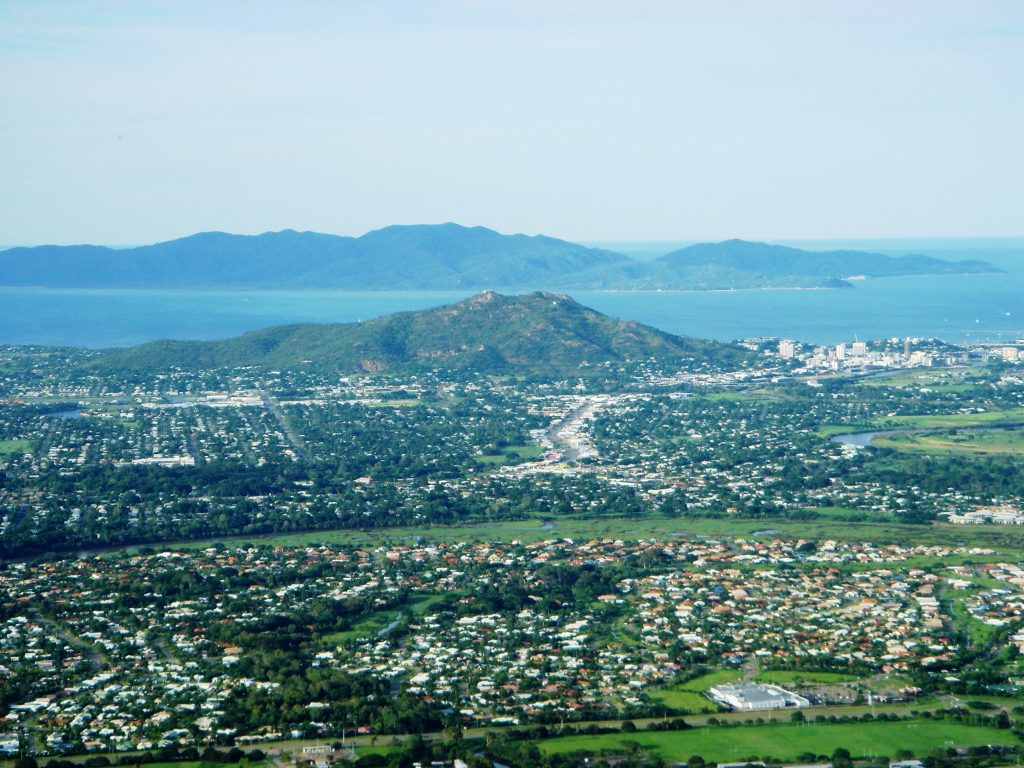 The panoramic view of Townsville with Castle hill on the right centre.