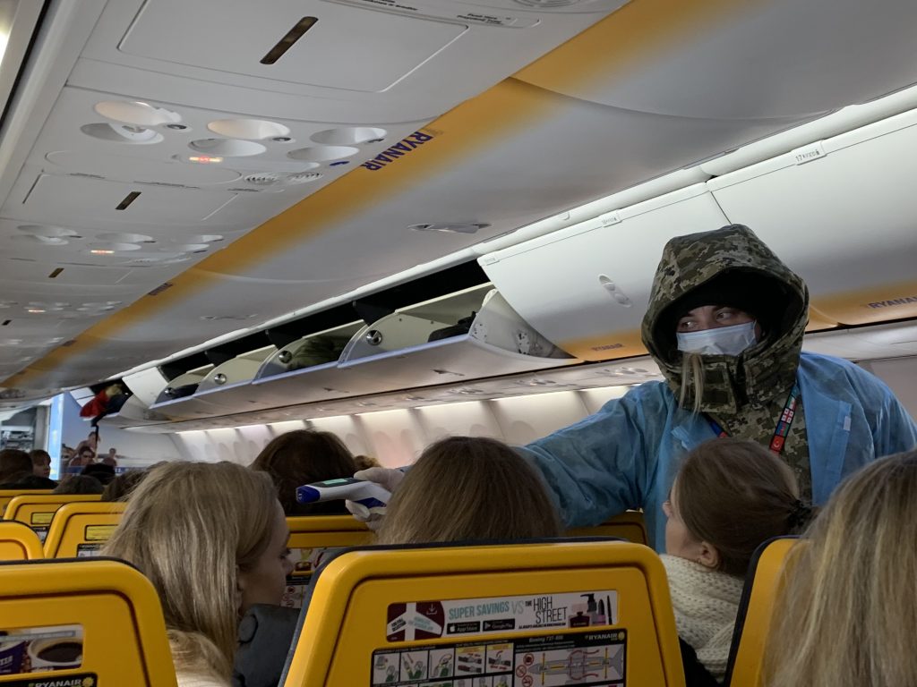 A picture that shows screening that happens inside the flight