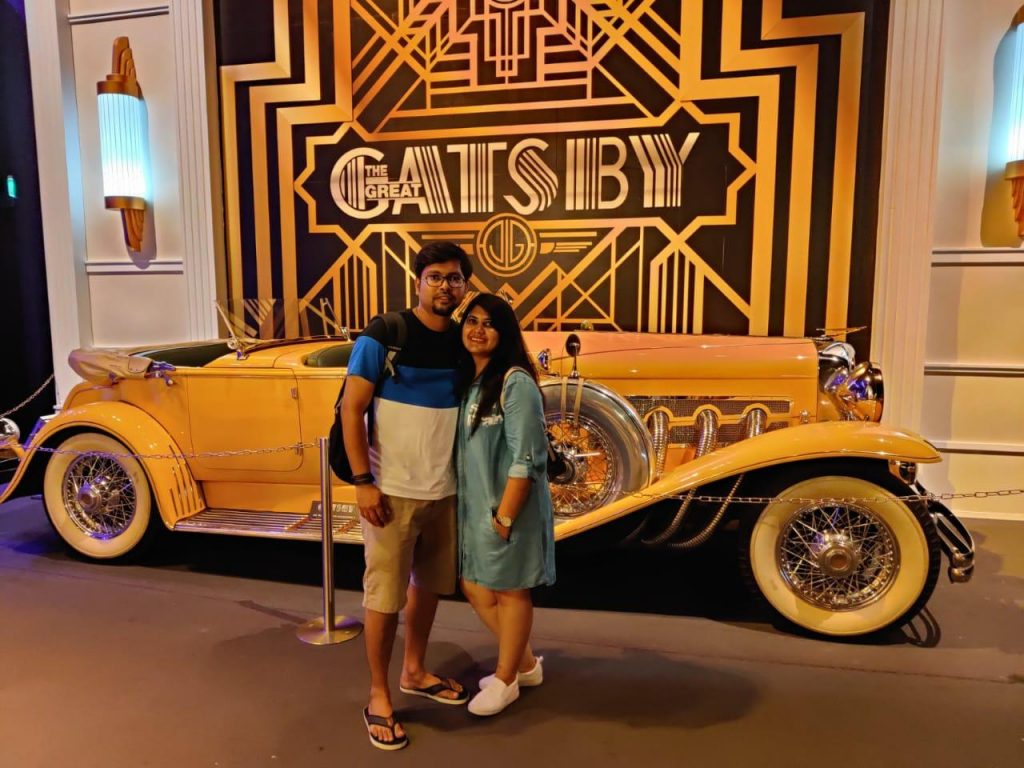 Enjoying Honeymoon to Australia In front of a model car