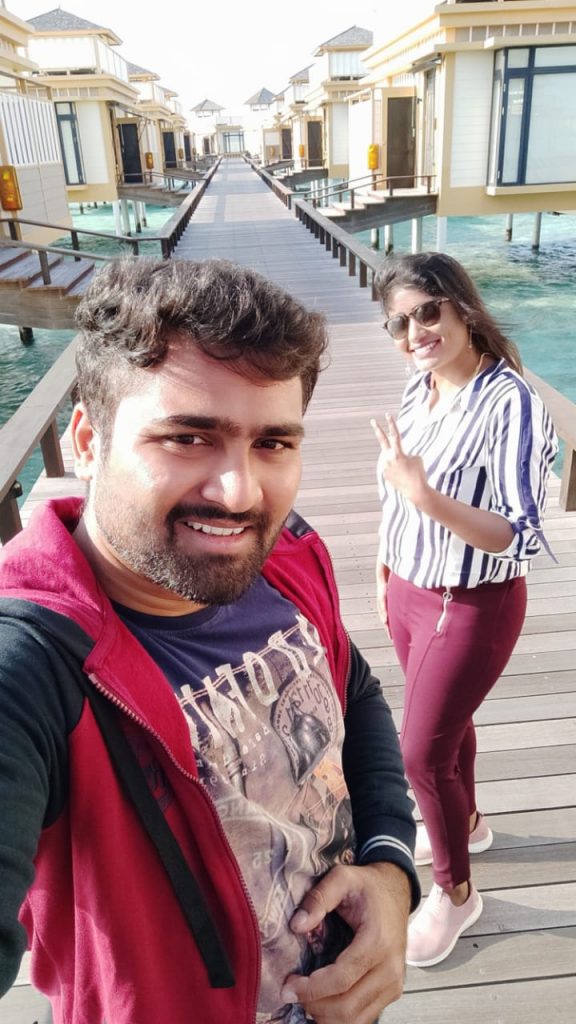 with my husband in the water bunglow during our trip to the Maldives
