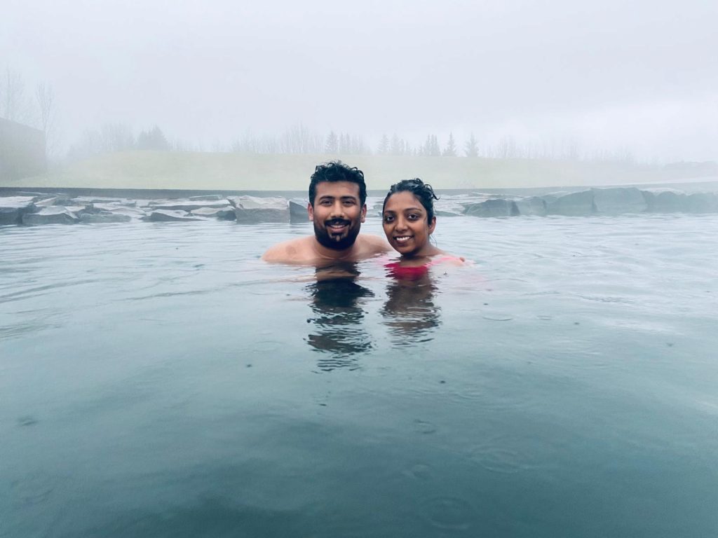 A picture of a couple enjoying Blue lagoon in Iceland