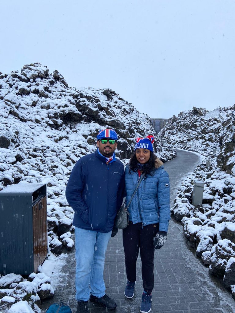 A couple standing on the roads of Iceland in Europe