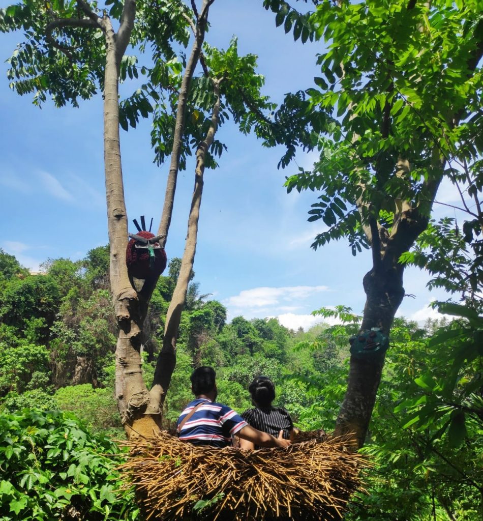 A picture of a couple with green surroundings in Bali