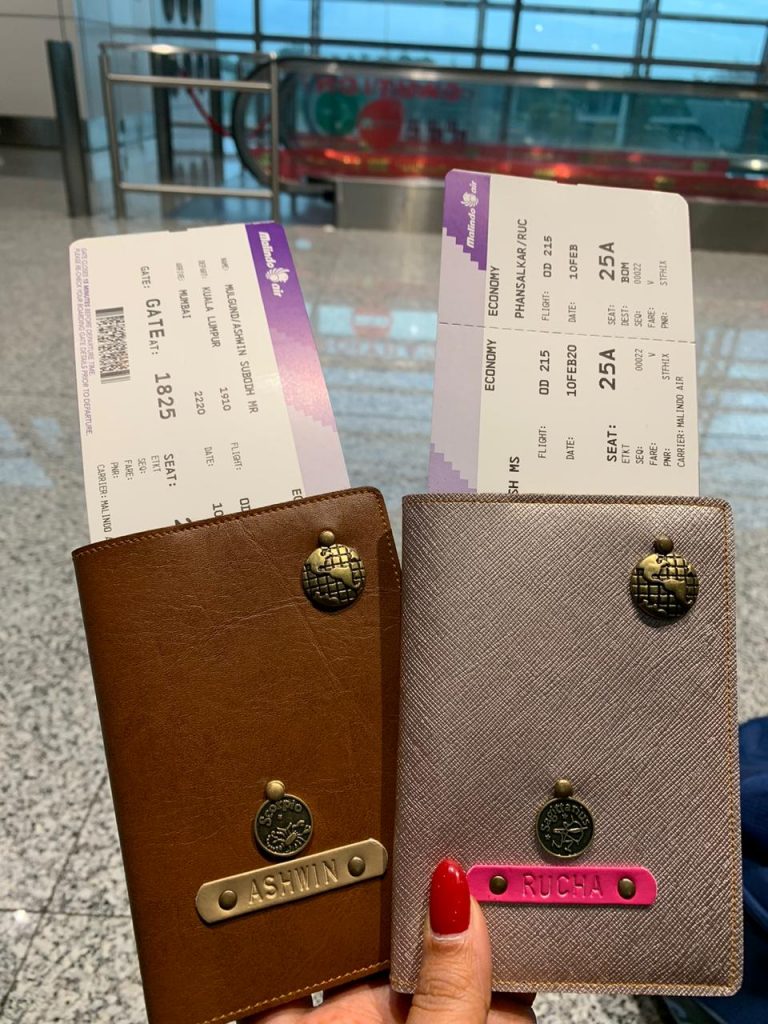 A picture of a couple's passports and flight tickets for their trip