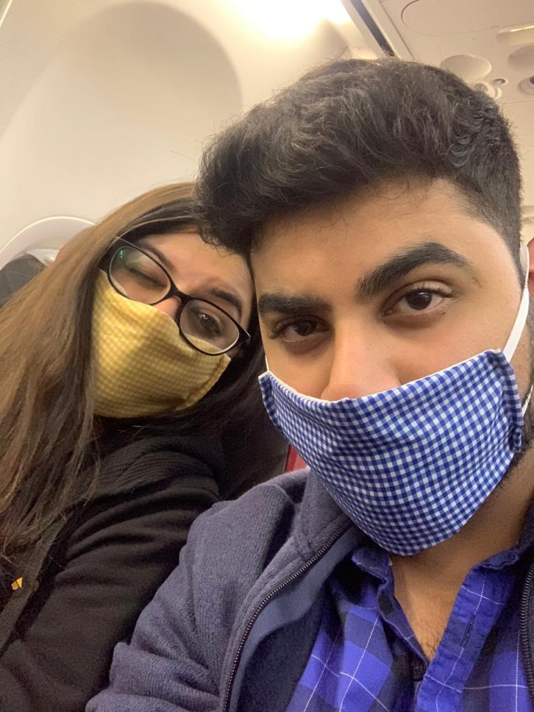 A picture of a couple staying safe by wearing masks in Bali