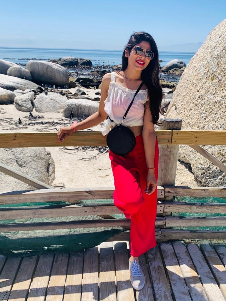 A picture of a woman posing in the beach