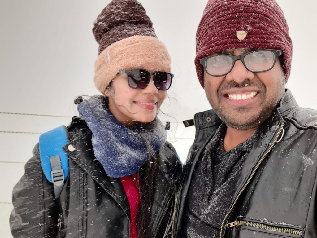 A picture of a couple adding a memory to their snow diaries