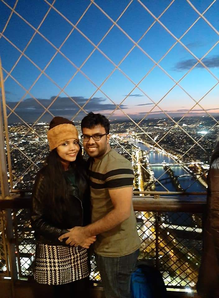 An amazing picture of a couple with happy smiles on their honeymoon vacation to Europe