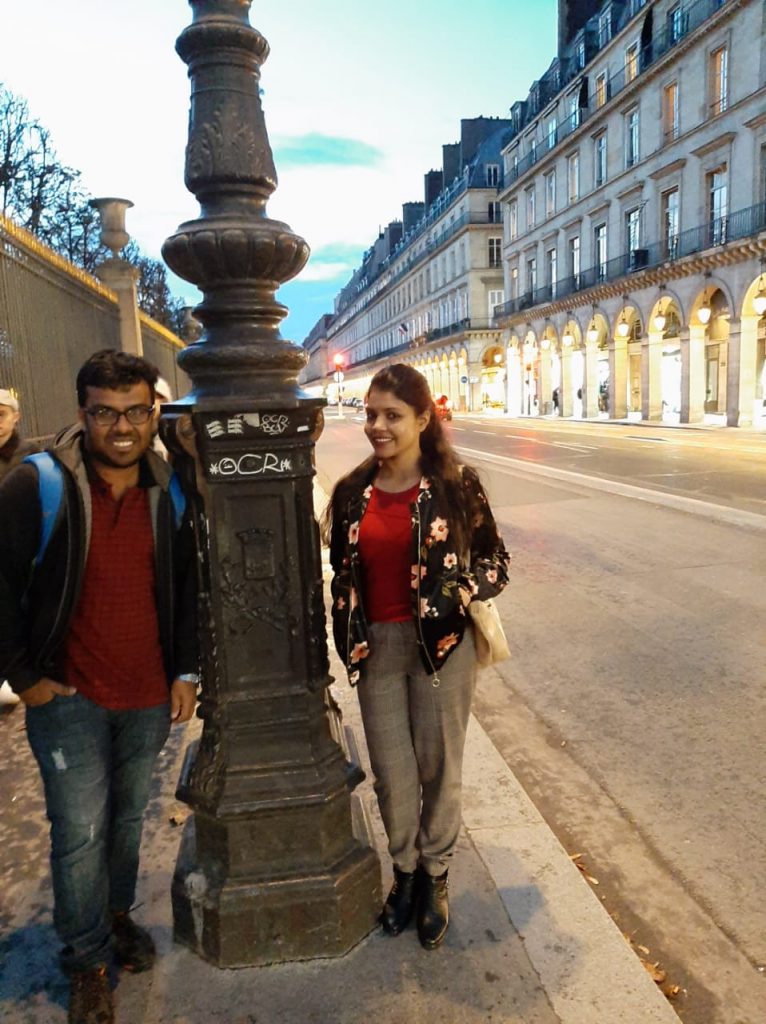 A picture of a couple wandering around the streets of Paris