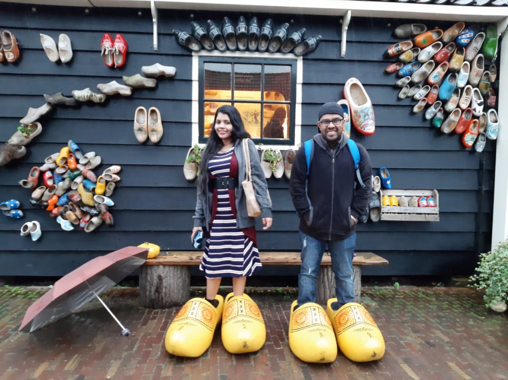 A picture of couple having fun in Amsterdam on their honeymoon vacation to Europe