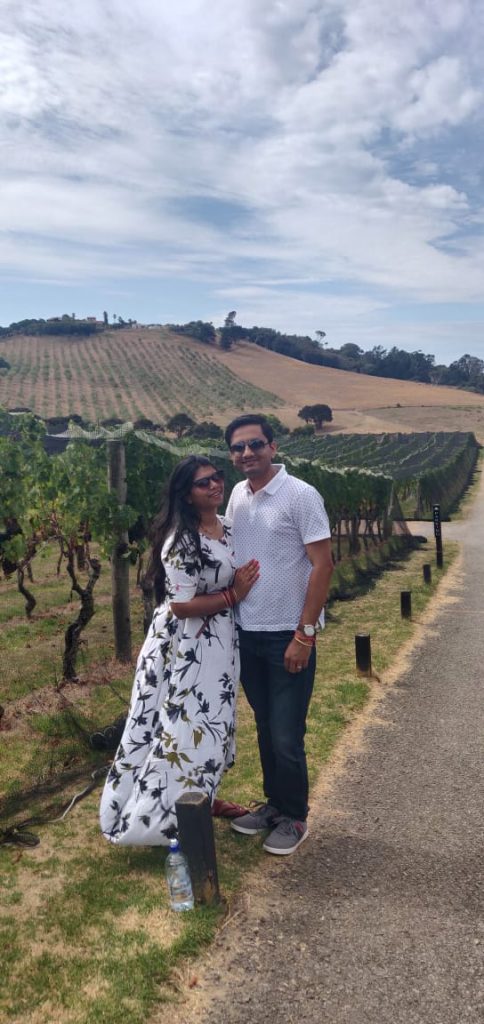 A picture of a couple posing at the Waiheke Island on their honeymoon vacation to New Zealand