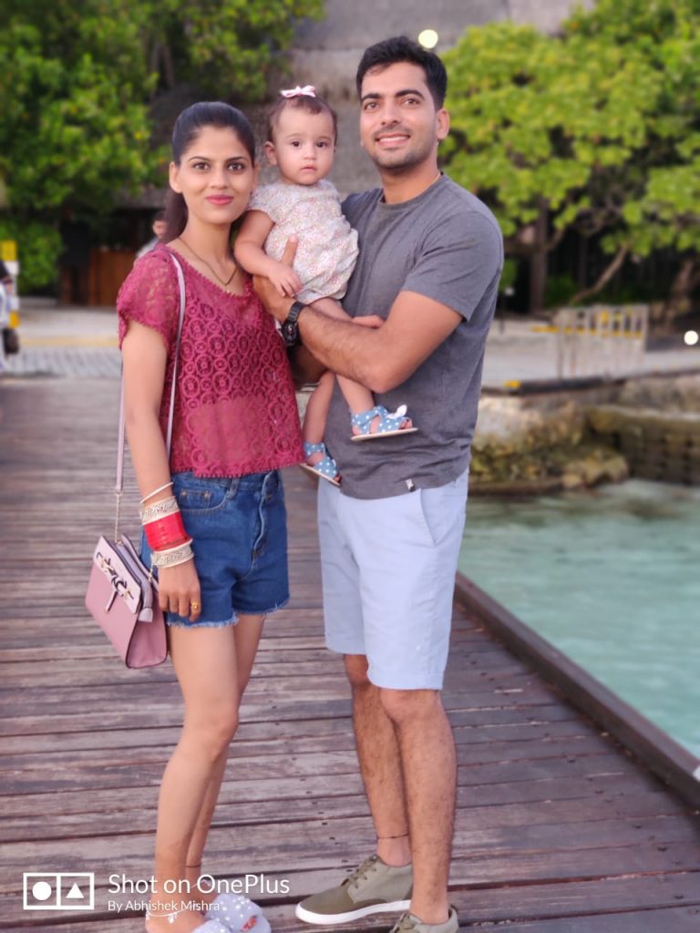 With a cute baby during our Maldives honeymoon