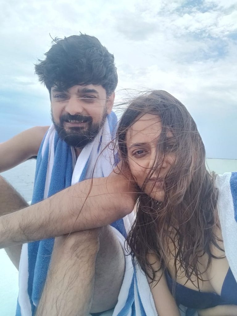 With husband at the beach