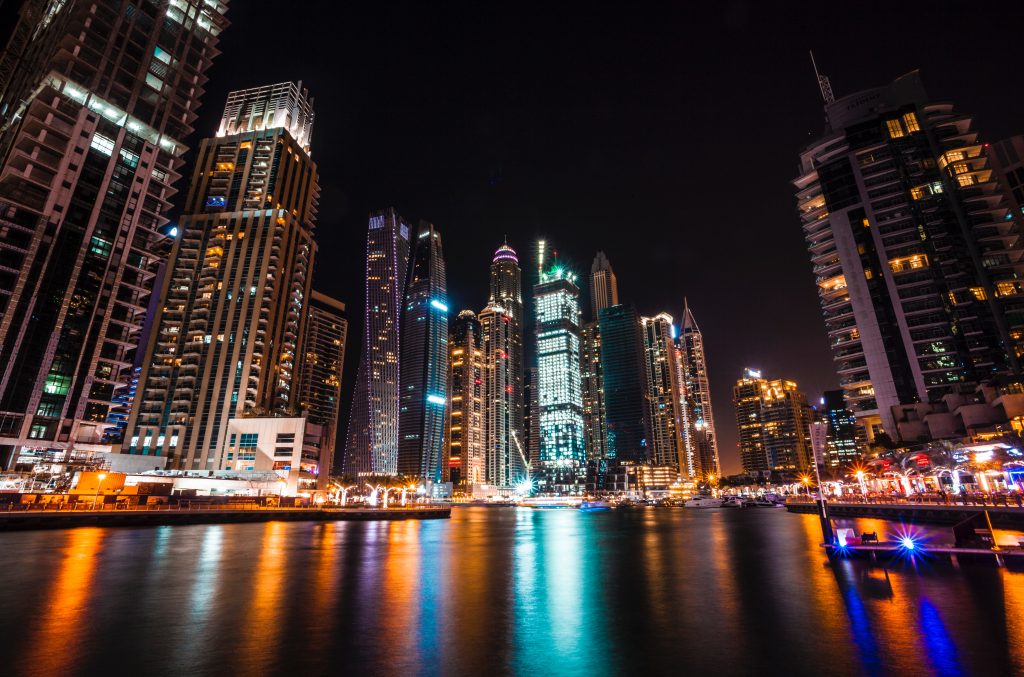 A beautiful picture of Dubai in lights and its reflections on the water