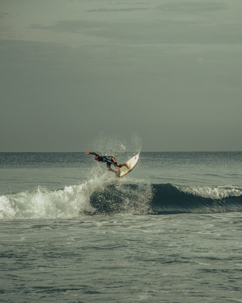 A picture of a man enjoying watersports in Varkala Beach in Kerala