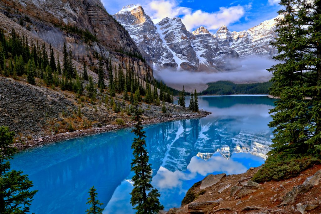 A picture of mountains in Banff with a river flowing in between
