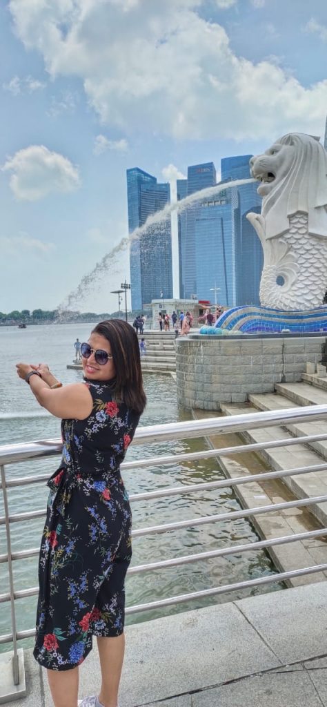 With the lion in the lion city