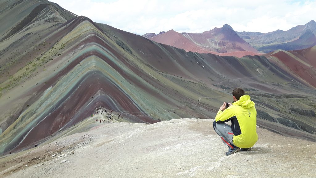 An image of a tourist admiring the mountain