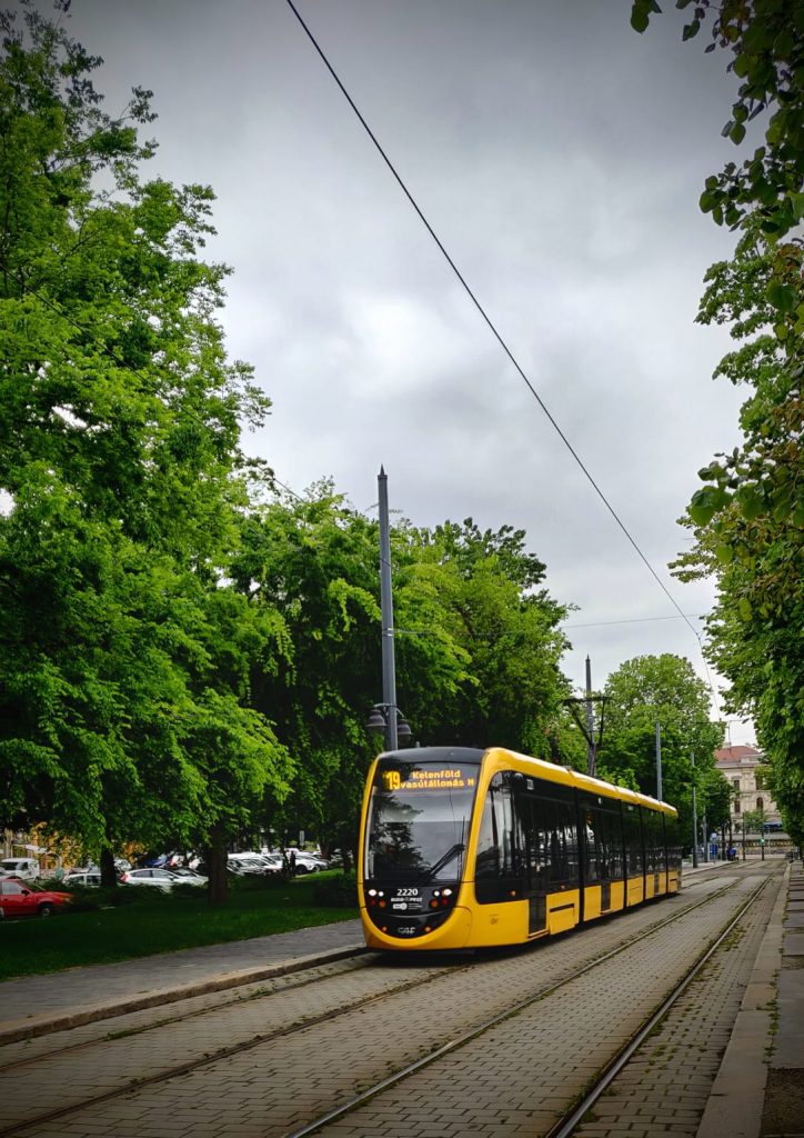 A picture of a bus that was taken at Budapest, on a happy vacation