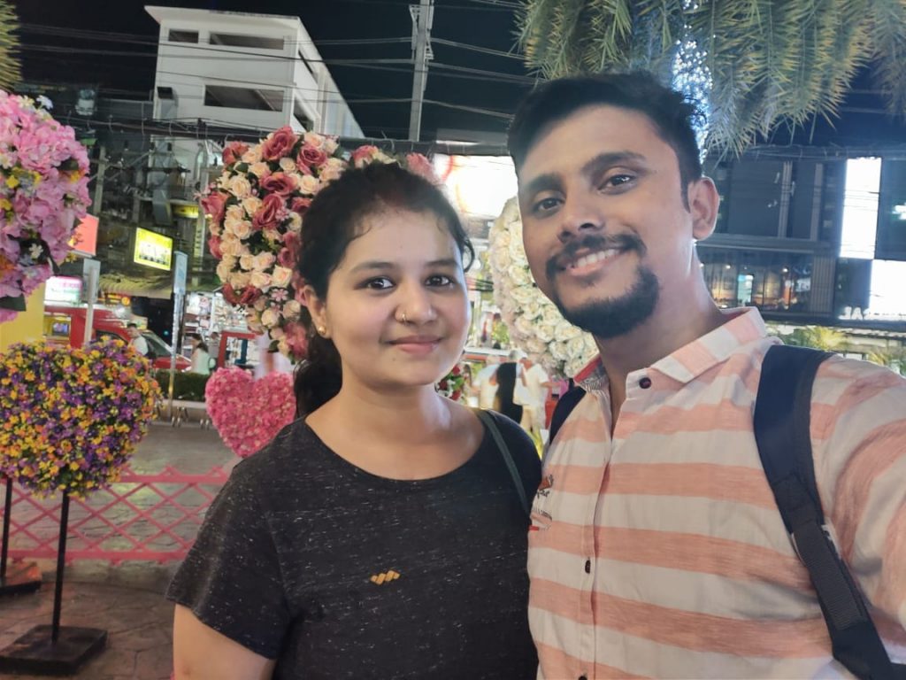 A picture of a couple that was taken on their trip