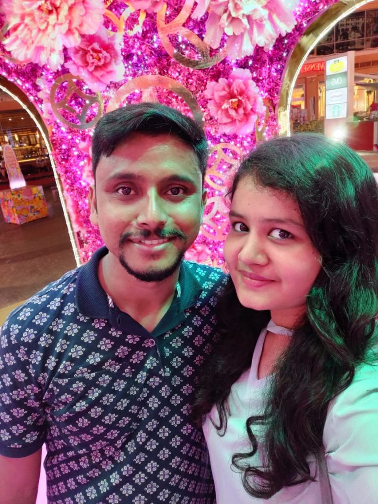 A couple clicking a happy selfie