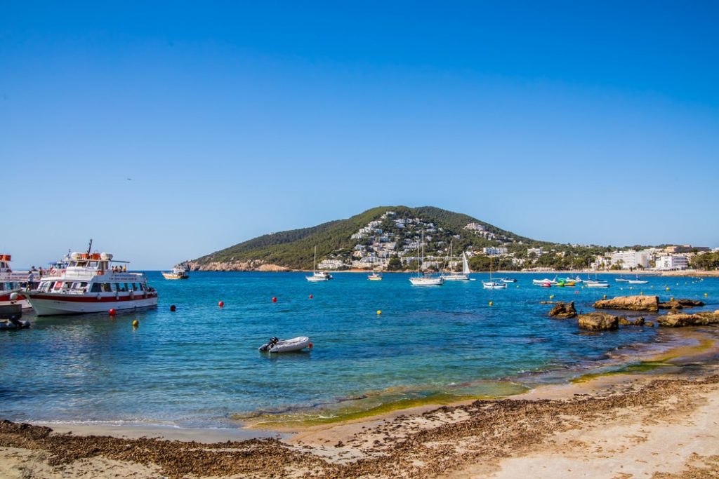 ships sailing in the blue sea water